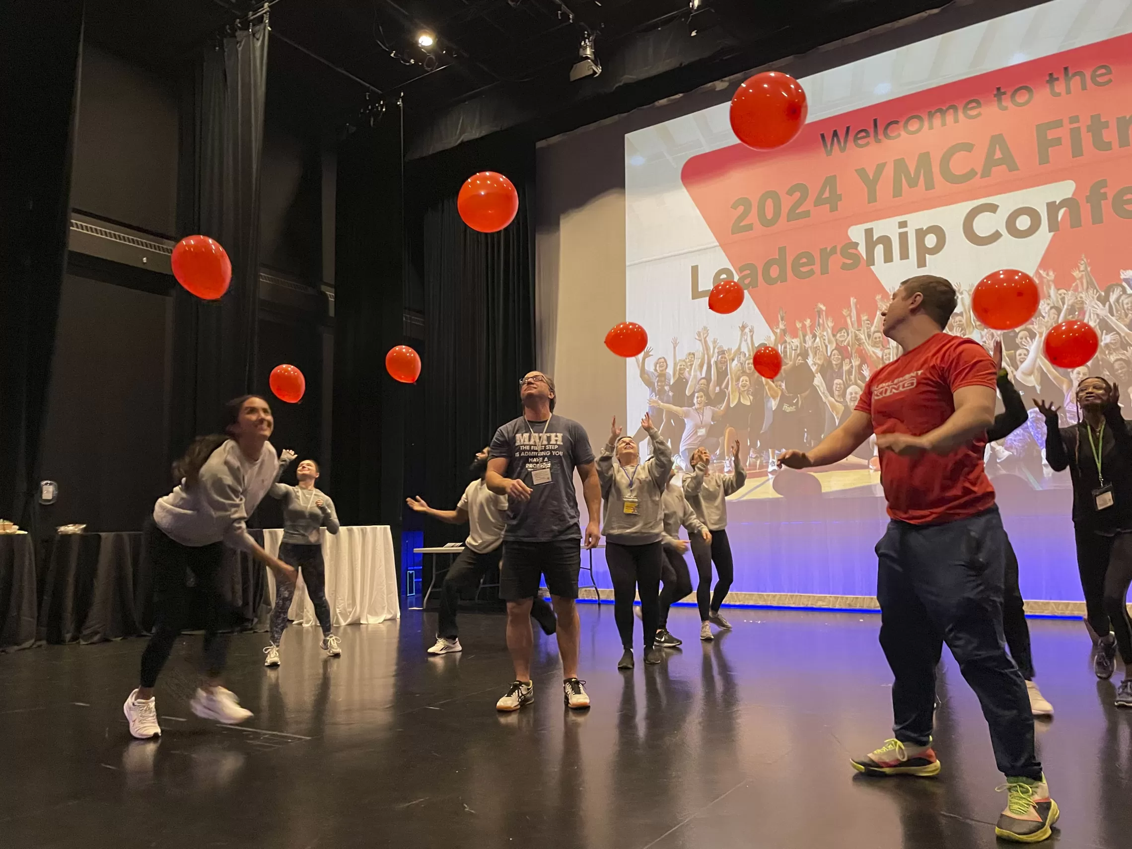 A group of fitness instructors with balloons