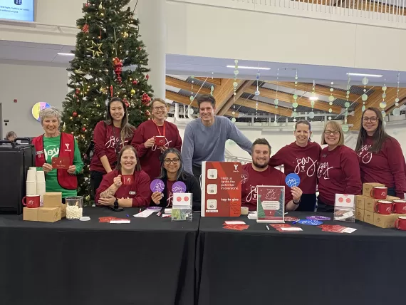 A group of people in a holiday-themed setting on JOY day at the YMCA